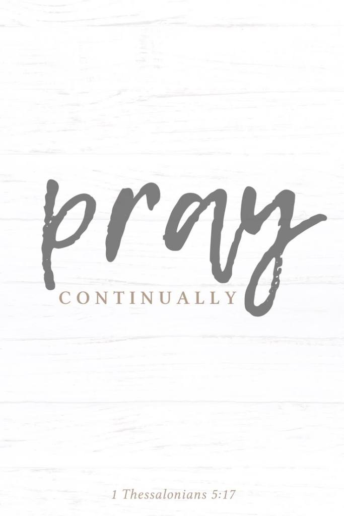 Text design featuring the phrase 'pray continually' in a stylish font against a light wooden background, with a scripture reference from 1 Thessalonians 5:17.